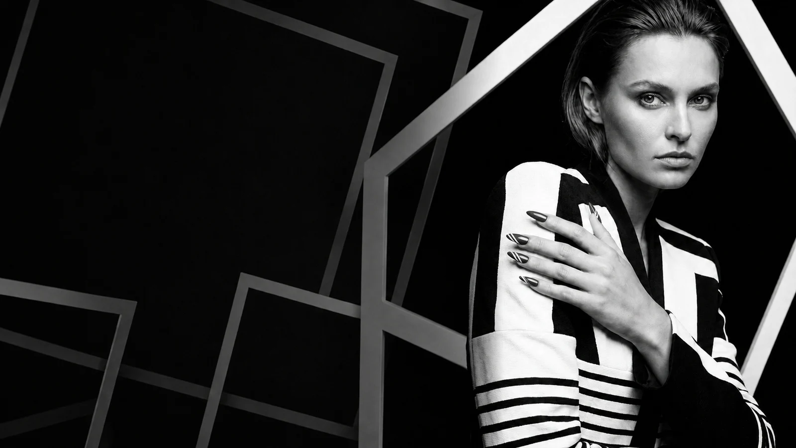 Black-and-white Vittorio Vittoria portrait framed by geometric lines