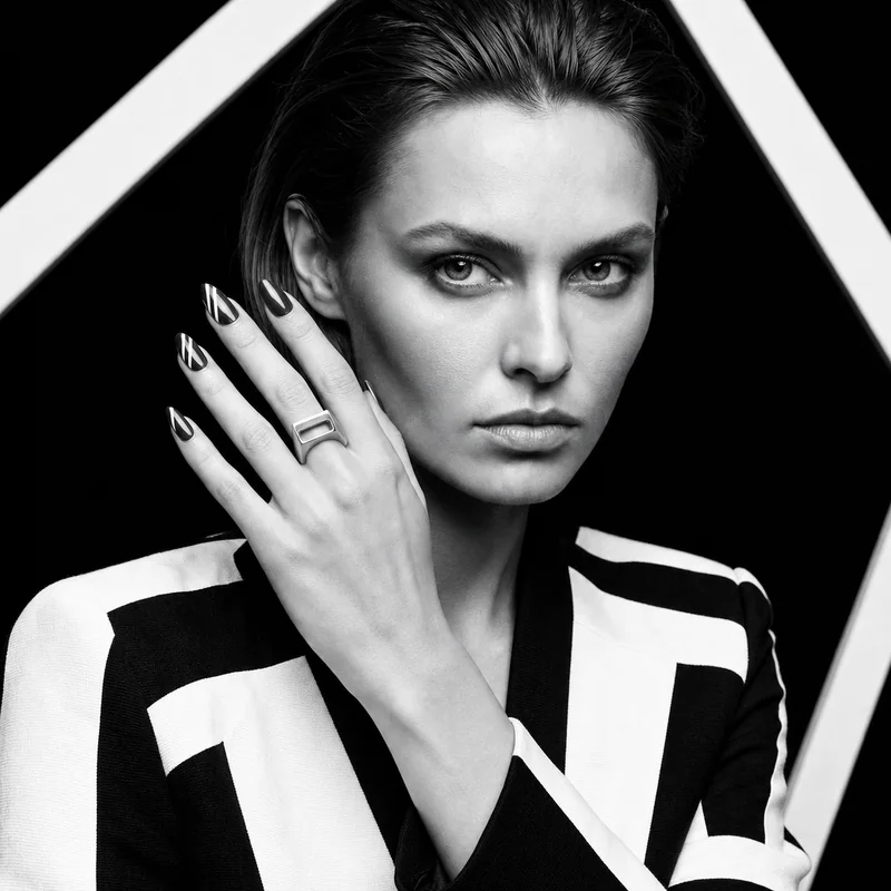 Offset Portal design shown on a hand in a black-and-white portrait