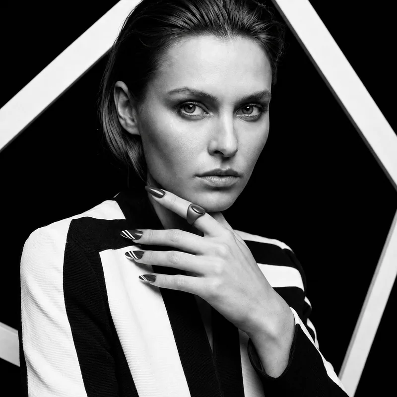 Fault Line design shown on a hand in a black-and-white portrait