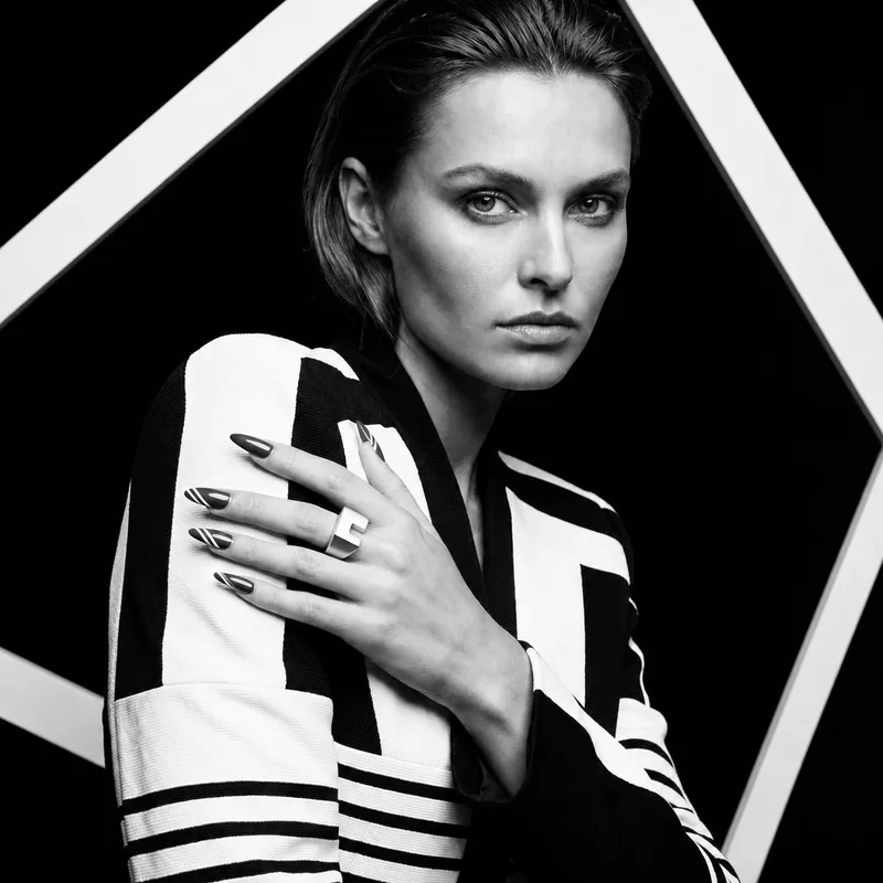 Corner Block design shown on a hand in a black-and-white portrait