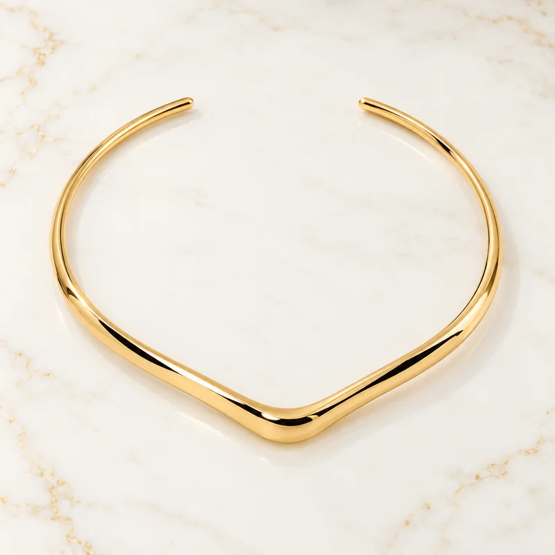 Apex Collar design preview with a slender gold rail forming a broad shallow V