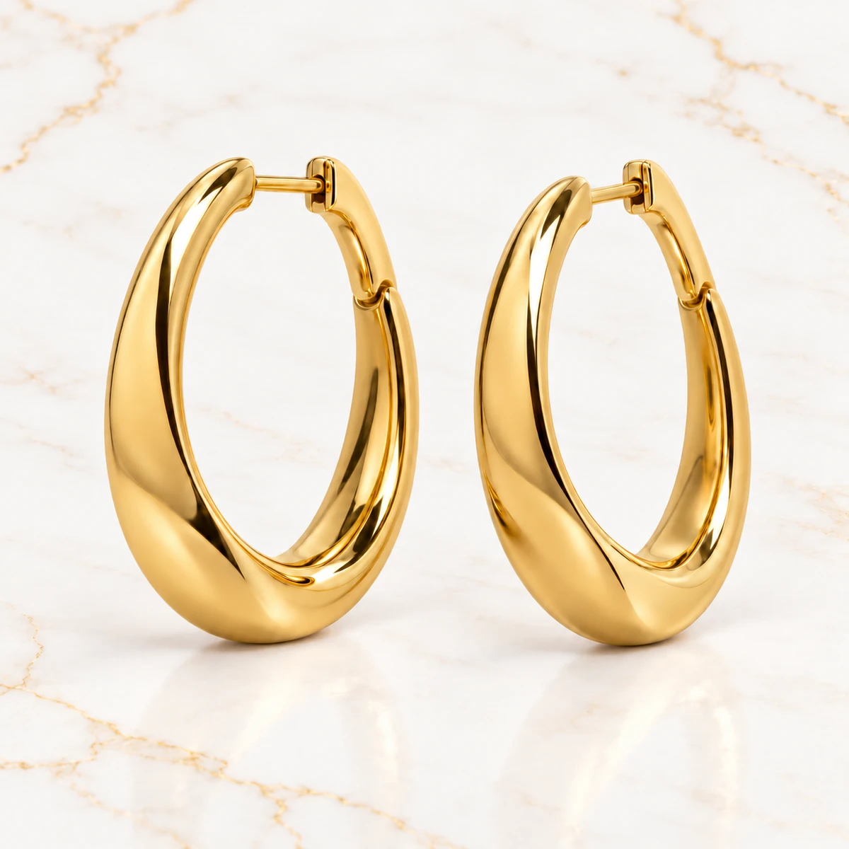 Contour Hoops design preview with polished gold oval silhouettes and gently pinched lower curves