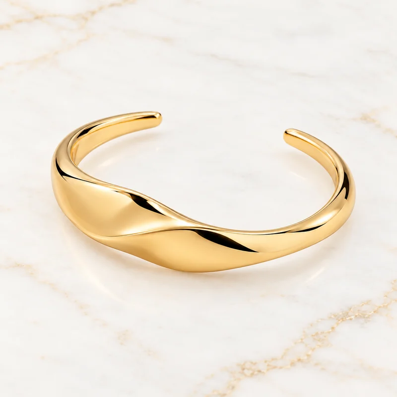Folded Current Open Cuff design preview with a broad gold ribbon front and low diagonal fold