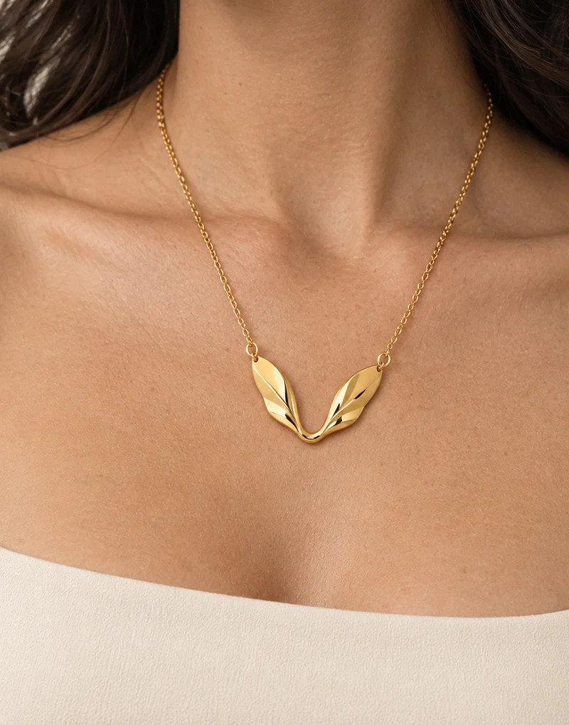 Twin Sail Pendant design shown on a model, wearing view 1